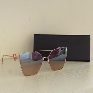 Fendi 63mm oversized cat eye gradient subnglasses with gold frame.